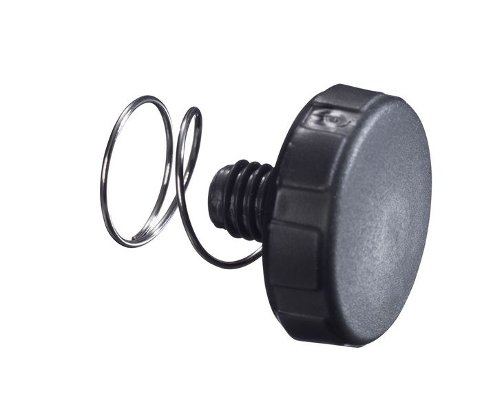 Material quantity regulation with spring